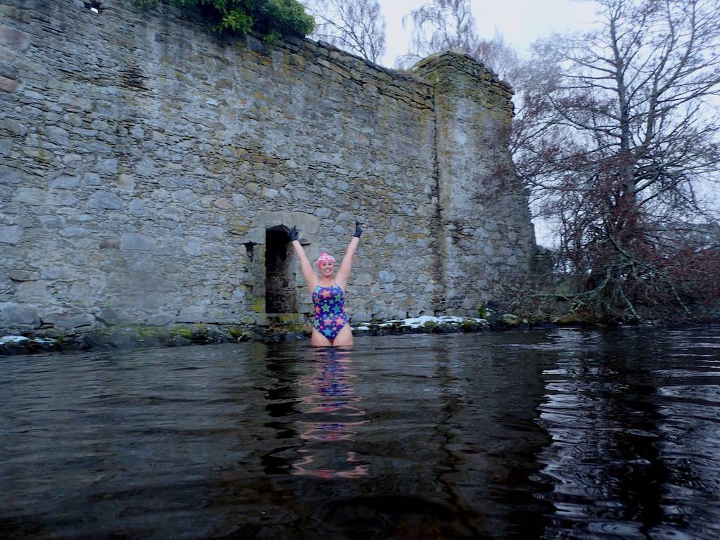 Alice Goodridge, SwimWild, in front of the castle at Loch an Eilein
