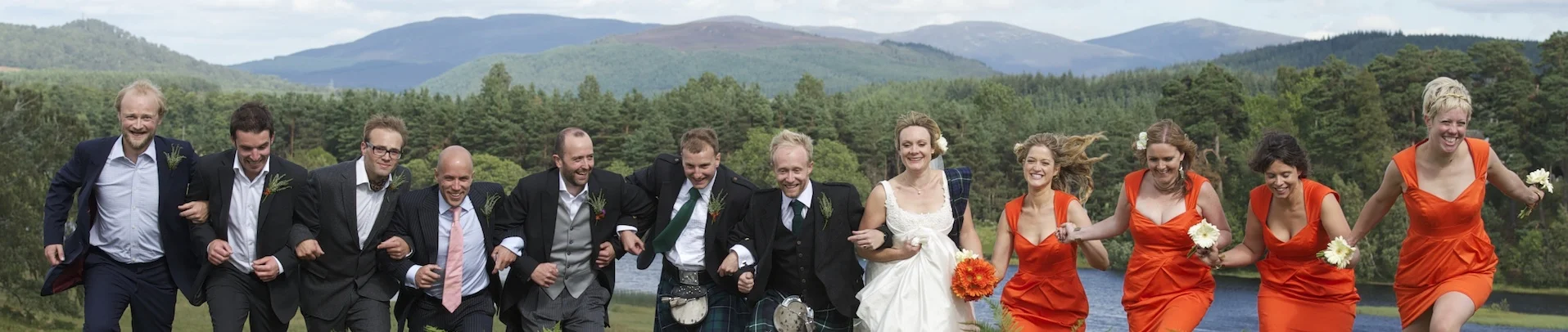 Wedding party running through heather, from Macdonald Hotels