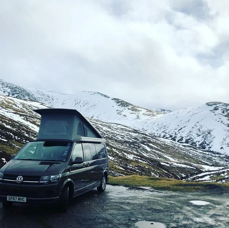 A campervan stops to admire the snow; photo by Chris Ridley-Smith